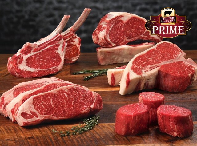 Certified Angus Beef Prime steaks and premium beef cuts displayed on a wooden butcher block.